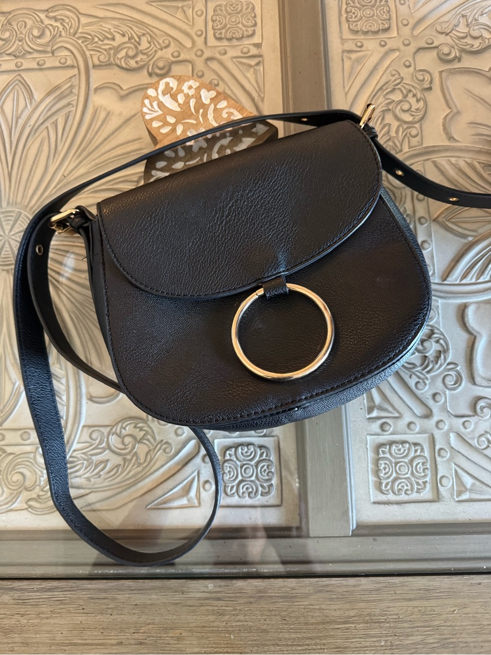 Black Crossbody Saddle Bag with Gold Ring Accent
